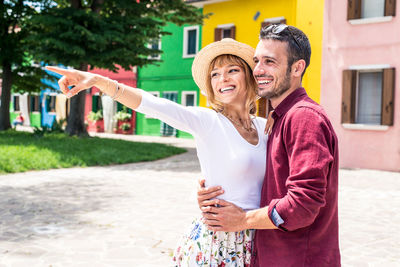 Happy couple standing outdoors