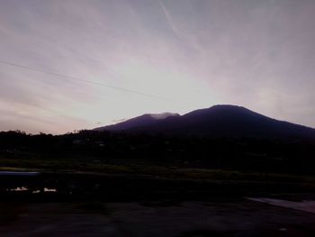 Scenic view of lake against sky at sunset