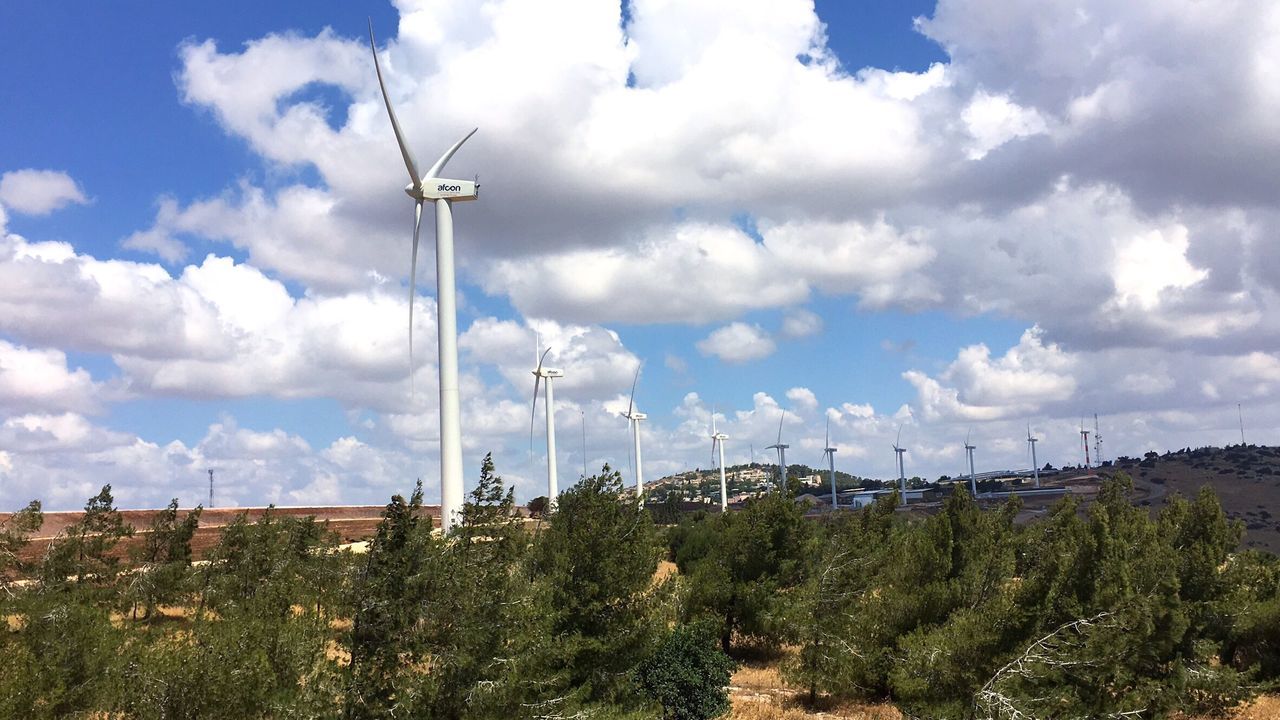 sky, fuel and power generation, cloud - sky, cloudy, wind power, technology, wind turbine, environmental conservation, windmill, field, alternative energy, renewable energy, cloud, landscape, tranquility, electricity, electricity pylon, nature, tranquil scene, growth