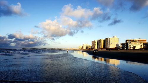 Vies of buildings against sky from beach