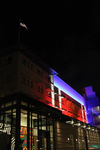 Low angle view of illuminated building at night