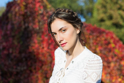 Beautiful young woman white lace blouse in park. summertime 