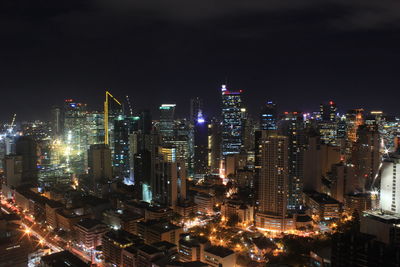 High angle view of illuminated buildings in city at night