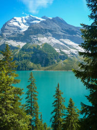 Scenic view of lake and mountains against sky