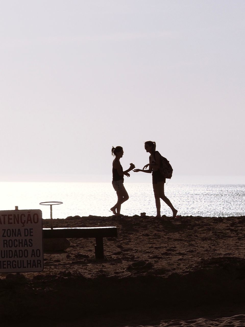 PEOPLE ON BEACH AGAINST SKY