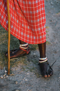 Close up of maasai warrior with a traditional sandals