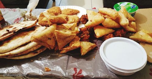 High angle view of meat and rice on table