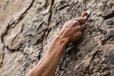 Human hand holding rock