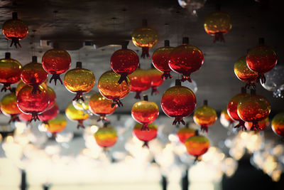 Low angle view of christmas lights hanging from ceiling