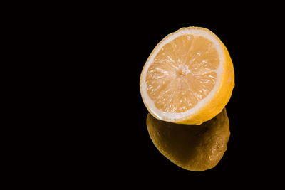 Close-up of lime on black background