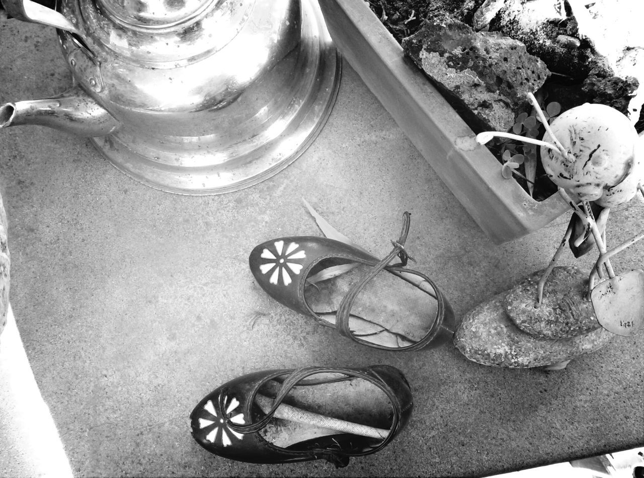 high angle view, indoors, still life, metal, close-up, table, no people, day, sunlight, container, directly above, equipment, part of, wheel, old-fashioned, metallic, food and drink, old, bottle