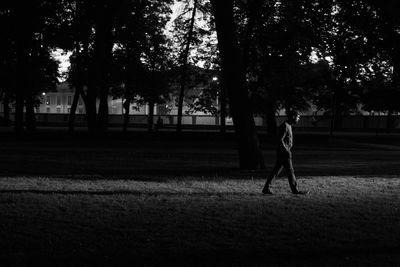 Side view of man walking in park