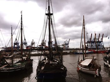 Boats moored at harbor