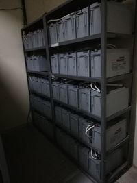 Stack of books in shelf at home