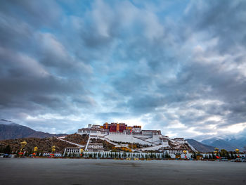 View of buildings against cloudy sky