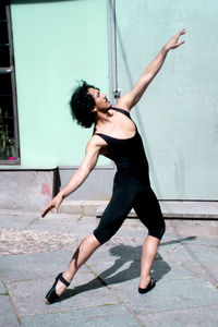 Side view of woman walking in city