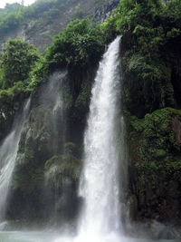 Scenic view of river flowing through rocks