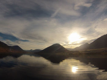 Scenic view of lake against sky during sunset