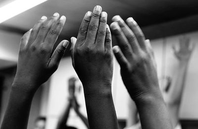 Cropped image of students hands in classroom