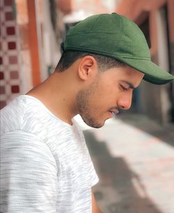 Close-up of young man looking away outdoors