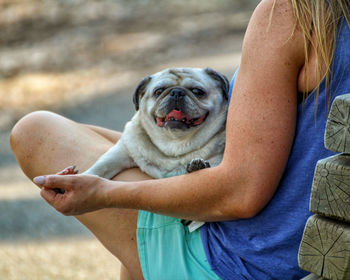 Midsection of woman with dog