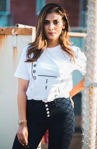 Portrait of beautiful young woman standing outdoors