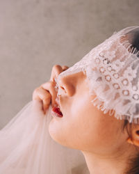 Close-up of young woman wearing veil