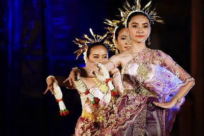 Full length of young woman dancing at night