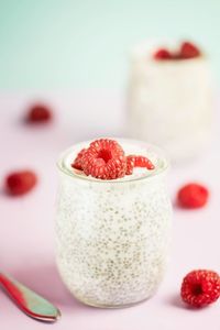 Close-up of strawberries on table against white background
