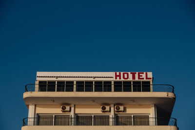 Low angle view of building against clear blue sky