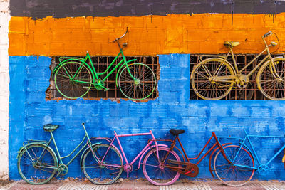 Bicycles parked against wall