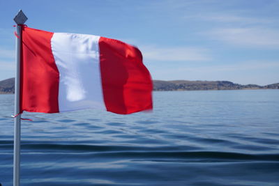 Close-up of flag against sky