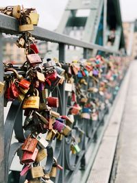 Padlocks hanging on railing