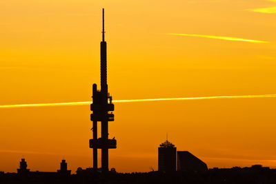 Silhouette of building against sky during sunset