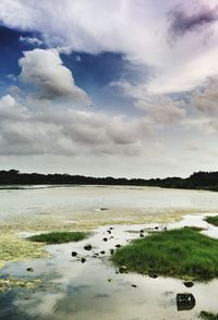 Scenic view of sea against cloudy sky