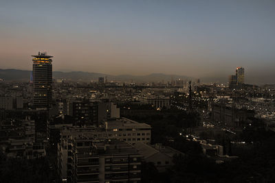 High angle view of illuminated buildings against sky during sunset