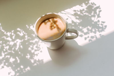 High angle view of coffee cup on table