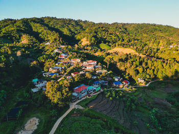High angle view of trees and buildings against sky