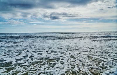 Scenic view of frozen sea against sky