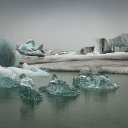 Scenic view of frozen lake against clear sky