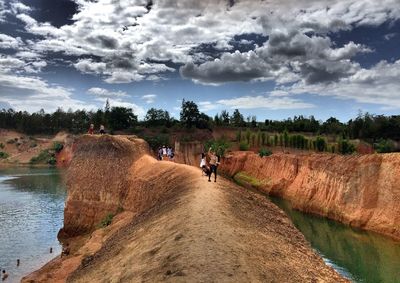 Scenic view of landscape against cloudy sky