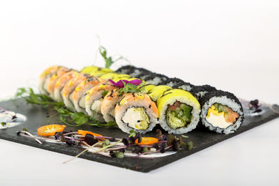 Close-up of sushi against white background