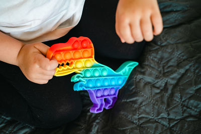 High angle view of boy playing with toy