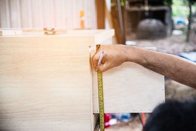 Person working on wooden table