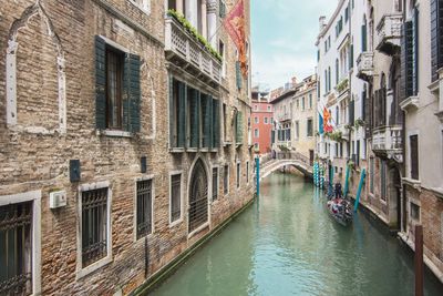 Canal passing through city buildings