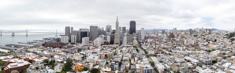 High angle view of modern buildings in city against sky