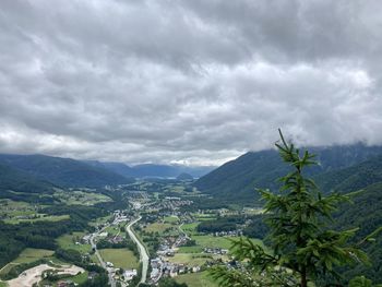 Scenic view of valley and mountains against sky