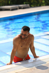 Young man in swimming pool