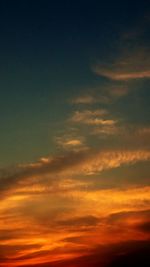 Low angle view of dramatic sky during sunset