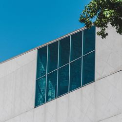 Low angle view of building against clear blue sky